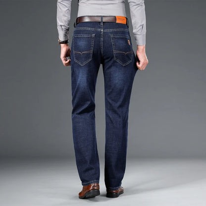 SHAN BAO 2026 autumn spring fitted straight stretch denim jeans classic style badge youth men's business casual jeans trousers
